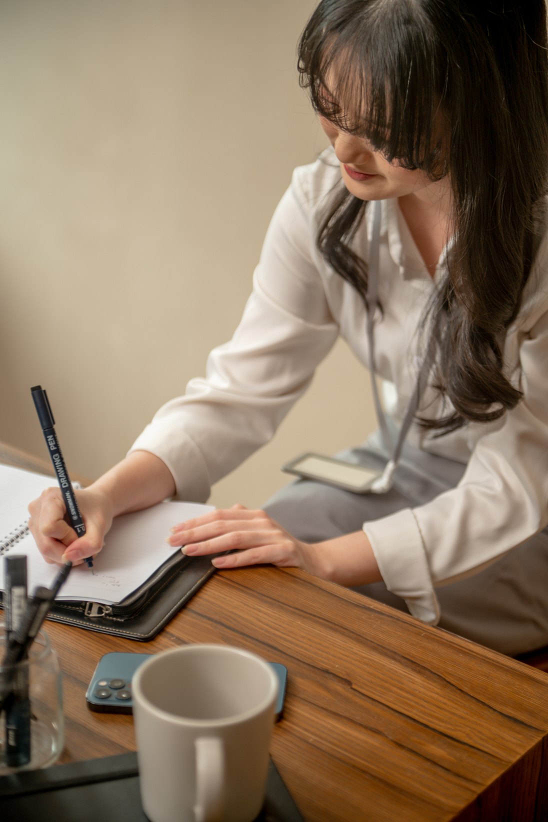 Young Korean Woman Working On A Table